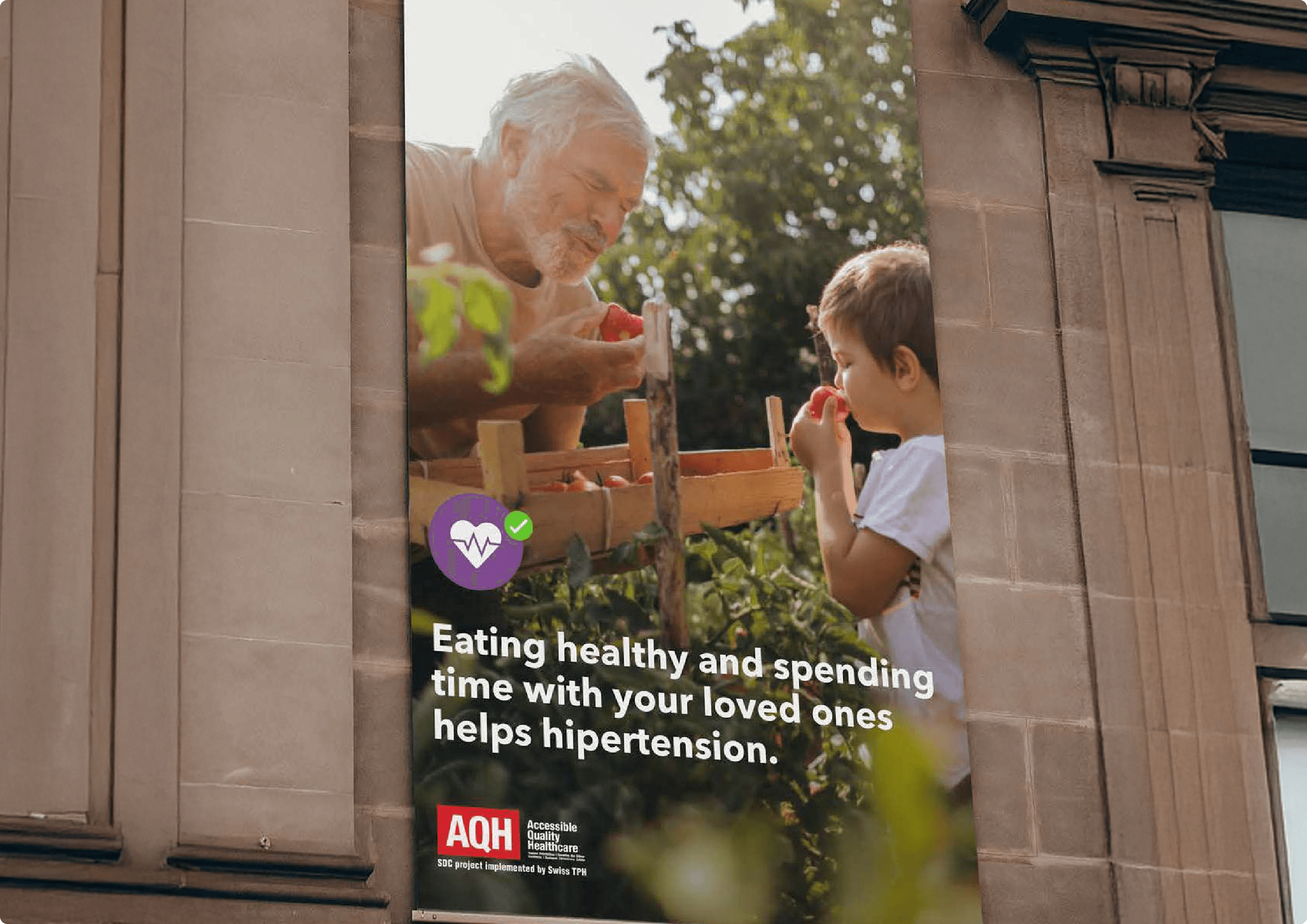 A street-level building billboard showing a grandfather and grandchild gardening together, with the headline 'Eating healthy and spending time with your loved ones helps hypertension.'
